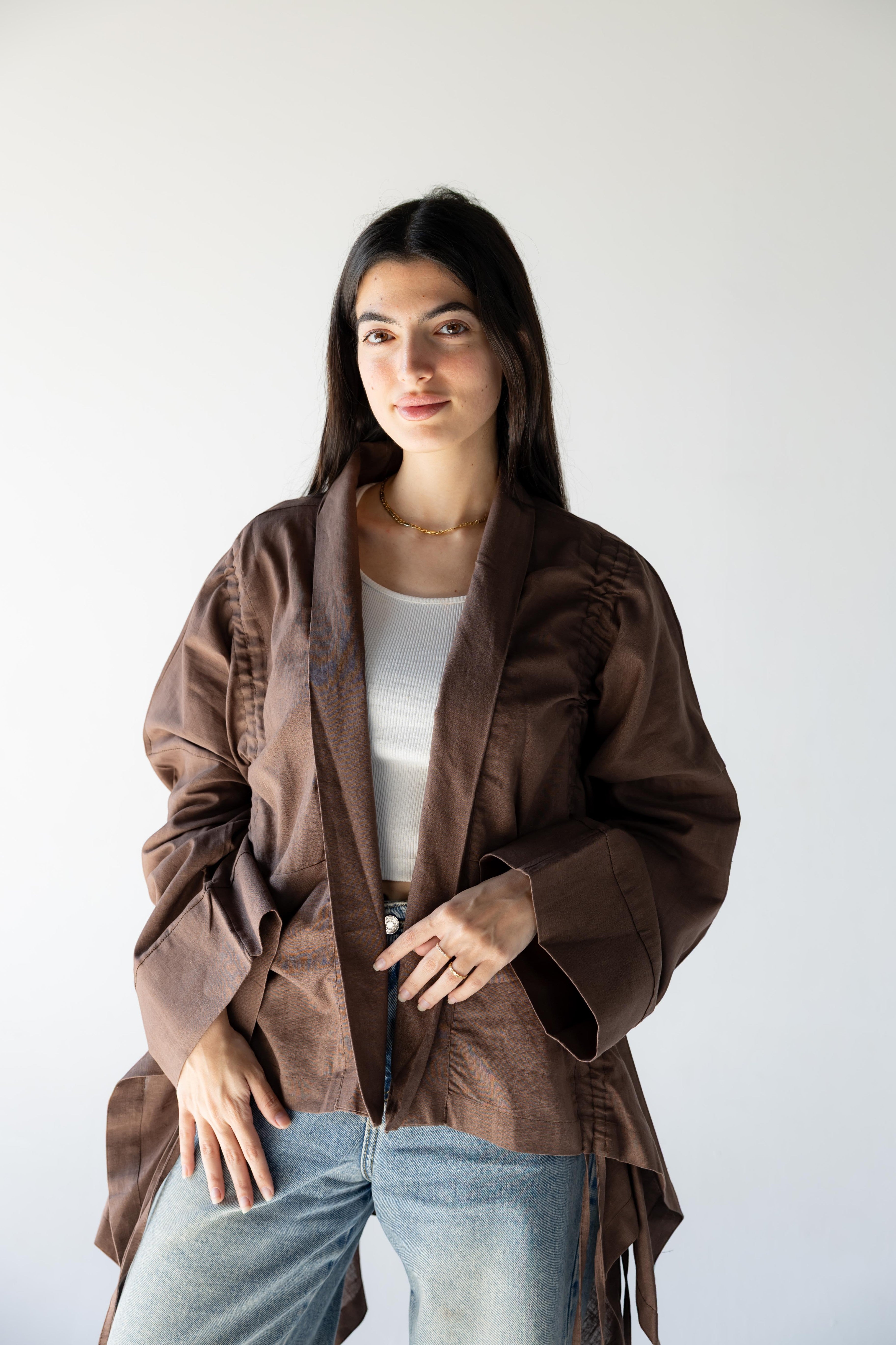ZONA Alma-Mocha Dune 100% linen jacket in earthy brown with statement sleeves and flowing details.