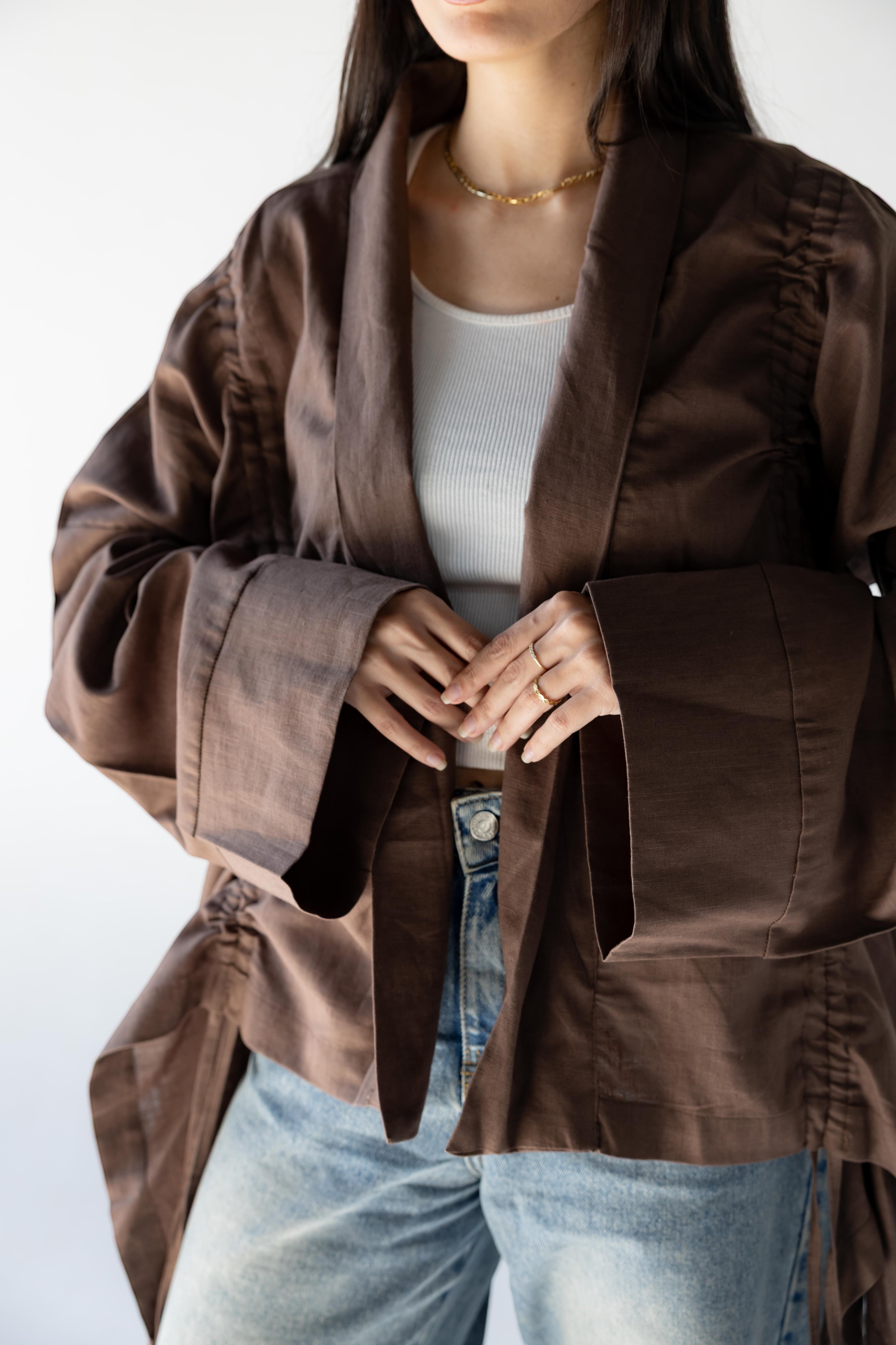 ZONA Alma-Mocha Dune linen jacket with statement sleeves in earthy brown, featuring flowing details and a relaxed silhouette.
