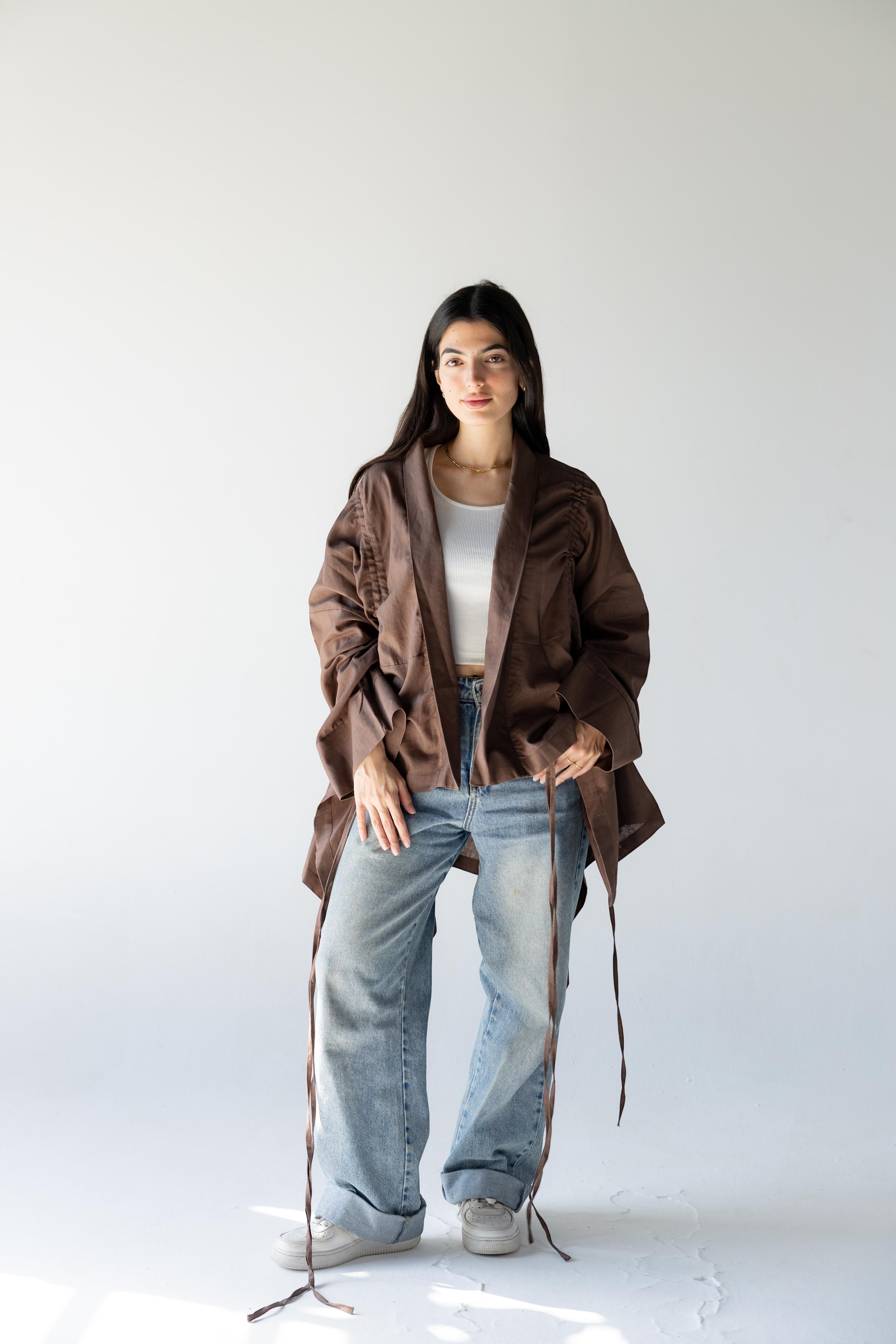 ZONA Alma-Mocha Dune 100% linen jacket in earthy brown with statement sleeves and tie details.